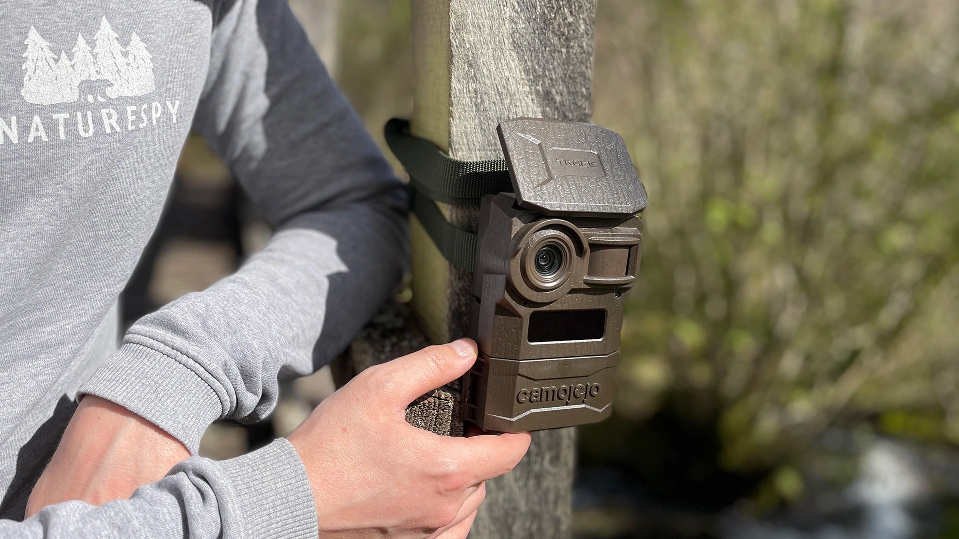 A Camojojo Trace cellular wildlife camera on a post