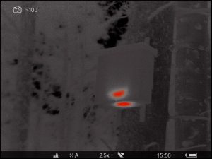Thermal image of a VWT style den box showing a red hot thermal image through a Pulsar thermal imager