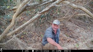 Setting up a camera trap at Shinganda Wildlife Wilderness